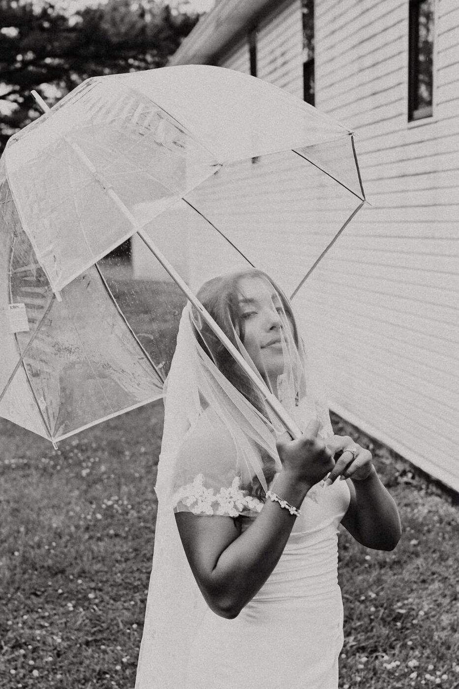 Wedding dress hanging in a farmhouse window