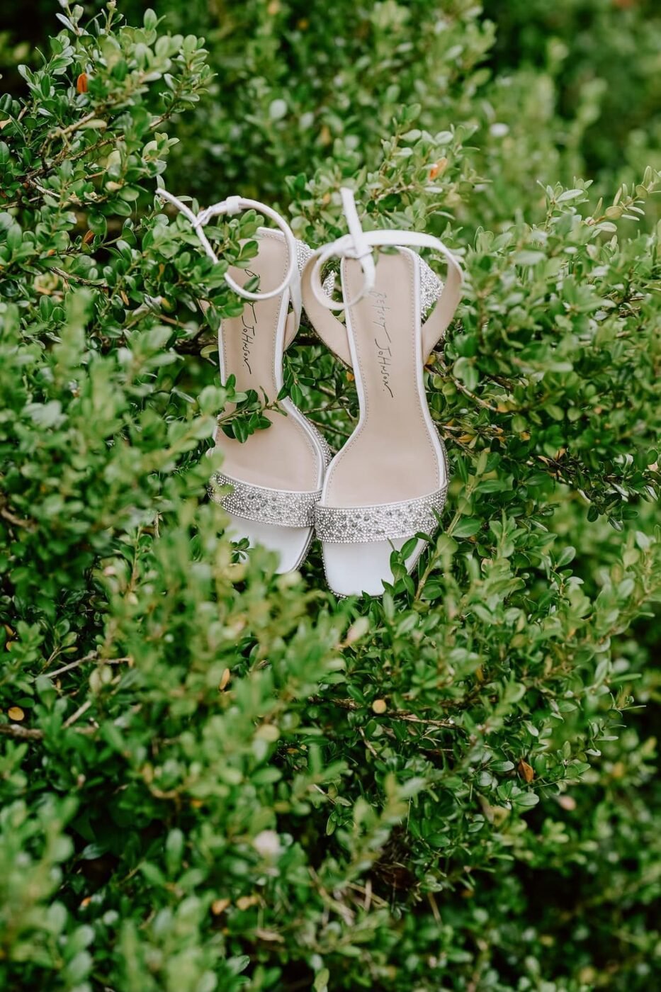 Wedding shoes detail in greenery